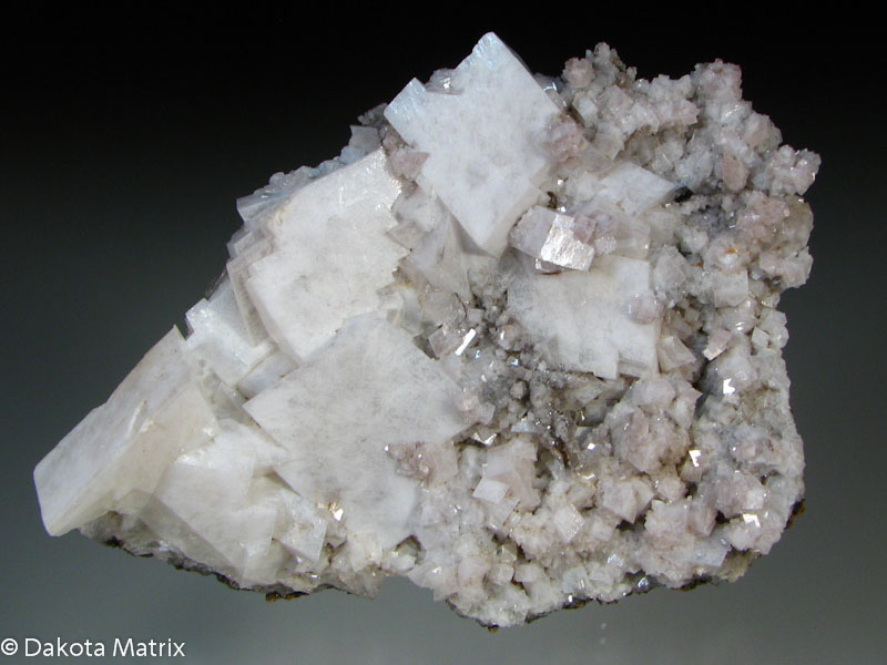 Dolomite - After I got to looking at this specimen, I realized how nice it actually is. The crystals of Dolomite are large and prestine. The largest crystal is 2cm wide. All about matrix...