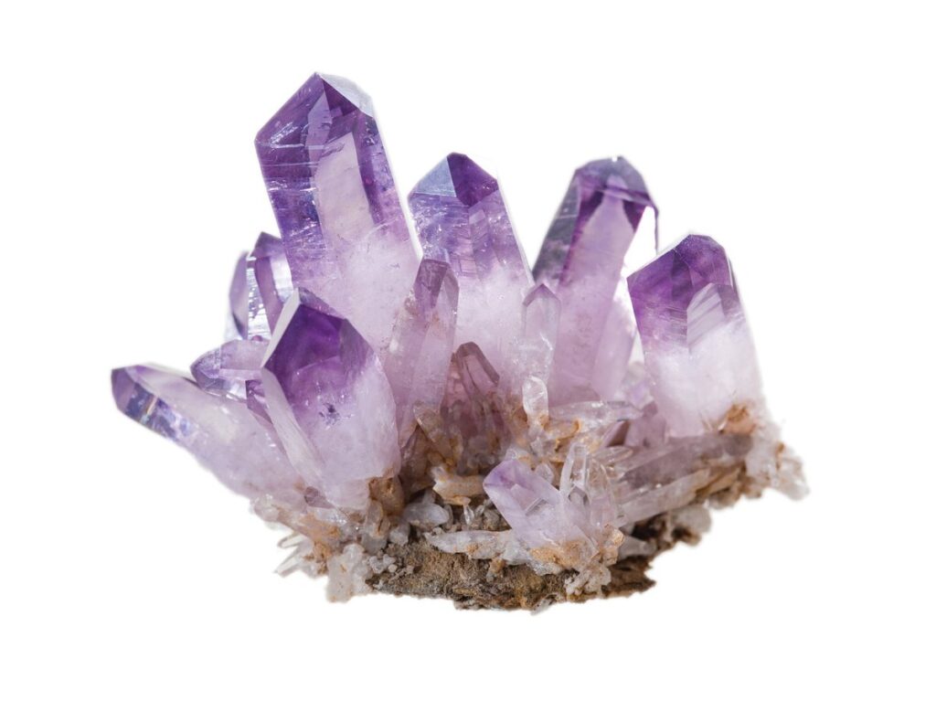 Amethyst quartz colored by iron-related crystal defects and natural radiation effects.