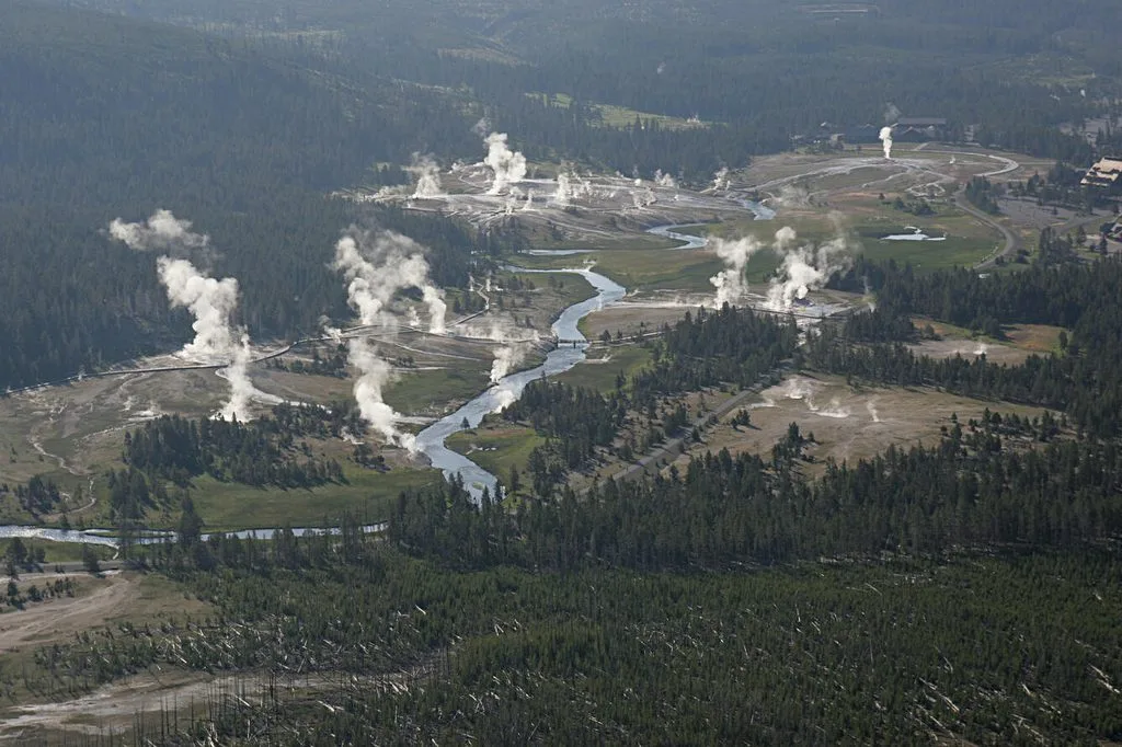 Aerial view of active geysers and hydrothermal features in Yellowstone's Upper Geyser Basin