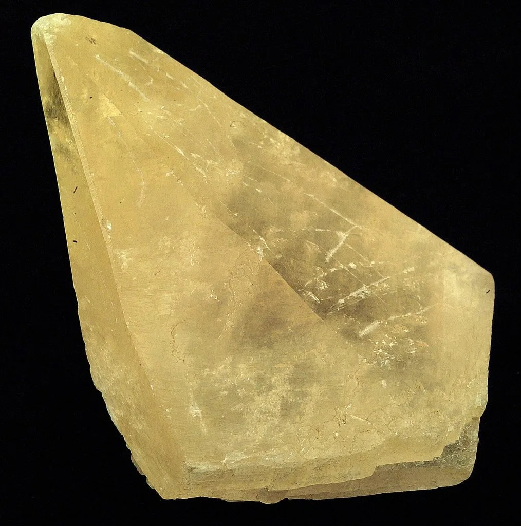 Natural calcite crystal showing characteristic cleavage and crystal form
