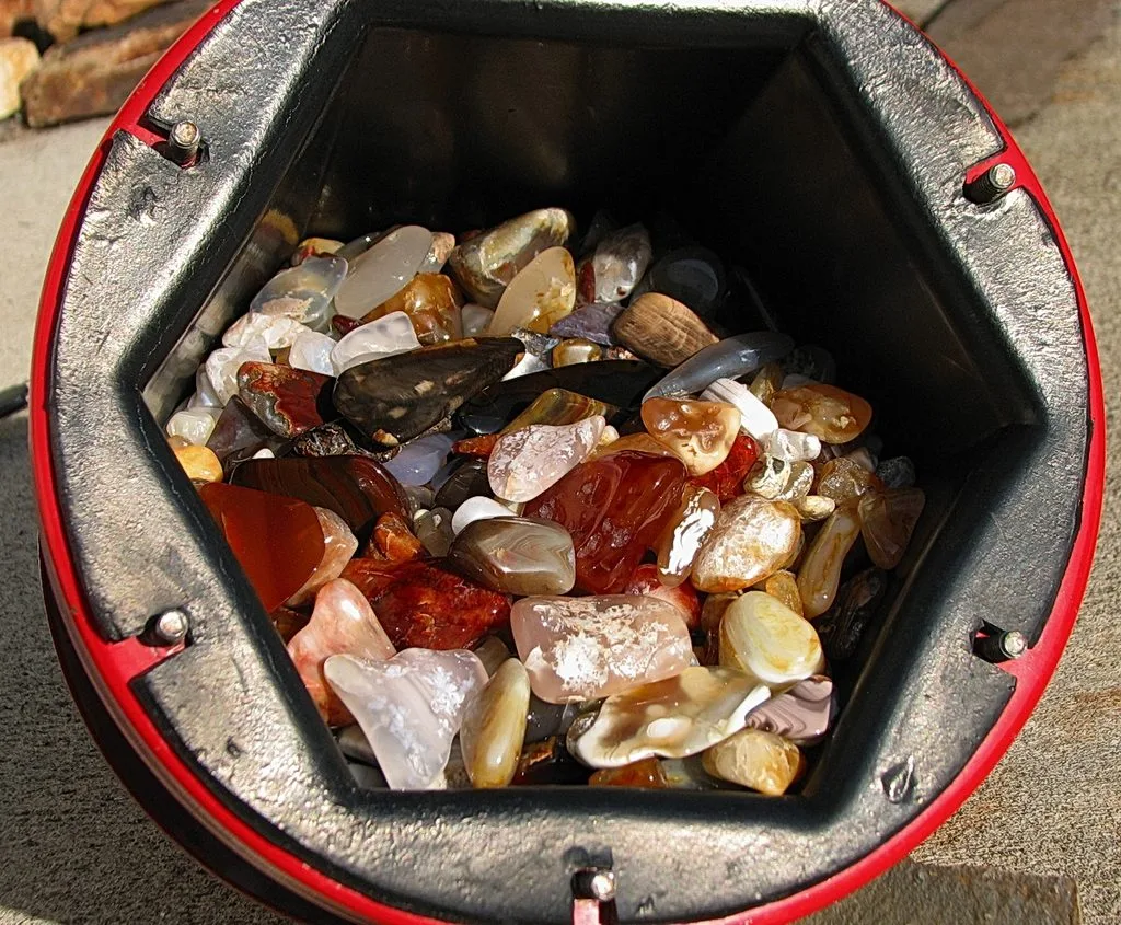 Tumbled agate and jasper stones showing differences in translucency color and pattern